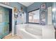 Bathroom featuring a large soaking tub and custom decor at 1131 S Blagg Rd, Pahrump, NV 89048