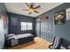 This bedroom provides a serene space with a ceiling fan, closet, and simple decor at 1131 S Blagg Rd, Pahrump, NV 89048
