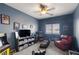 A cozy bedroom featuring a ceiling fan, game consoles, and unique decor, perfect for a gamer at 1131 S Blagg Rd, Pahrump, NV 89048