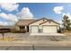 Charming single-story home with a two-car garage and desert landscaping at 1131 S Blagg Rd, Pahrump, NV 89048