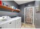A practical laundry room featuring a modern washer and dryer, and storage space at 1131 S Blagg Rd, Pahrump, NV 89048