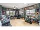 Bright living room with tile floors, plants, and large windows at 1131 S Blagg Rd, Pahrump, NV 89048