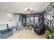 Comfortable living room with seating, tile flooring, and ceiling fan at 1131 S Blagg Rd, Pahrump, NV 89048