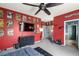 Main bedroom with modern comic book themed decor, ceiling fan, and walk-in closet at 1131 S Blagg Rd, Pahrump, NV 89048