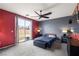 Main bedroom with a ceiling fan, and sliding door to the backyard at 1131 S Blagg Rd, Pahrump, NV 89048