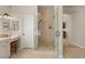 Modern bathroom featuring a spacious glass shower and a vanity with ample counter space at 1303 Panini Dr, Henderson, NV 89052