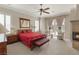 Spacious bedroom with a ceiling fan, and a decorative fireplace at 1303 Panini Dr, Henderson, NV 89052