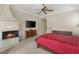 Inviting bedroom with a fireplace, television, and a comfortable bed at 1303 Panini Dr, Henderson, NV 89052