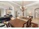 Elegant dining room with chandelier lighting and carpet flooring at 1303 Panini Dr, Henderson, NV 89052