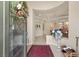 Grand foyer with decorative glass door, archways, and elegant tile flooring at 1303 Panini Dr, Henderson, NV 89052