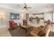 Open floor plan showcasing the living room with adjacent kitchen and coordinated furniture at 1303 Panini Dr, Henderson, NV 89052