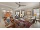 Spacious living room featuring carpet, ceiling fan, and neutral colors at 1303 Panini Dr, Henderson, NV 89052