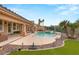 Inviting backyard pool with stone patio, ideal for entertaining and outdoor enjoyment at 1303 Panini Dr, Henderson, NV 89052