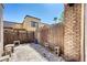 Private backyard area with a decorative fence, a minimalist landscape, and a secure block wall at 1501 Living Desert Dr # A, Las Vegas, NV 89119