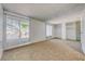 Large bedroom features two bright windows, neutral carpet and custom closet built-ins at 1501 Living Desert Dr # A, Las Vegas, NV 89119