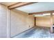Spacious carport providing covered parking with overhead beams and secure entry door at 1501 Living Desert Dr # A, Las Vegas, NV 89119