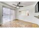 Bright dining area with sliding glass doors, brick floors, and a view to the outdoor space and kitchen at 1501 Living Desert Dr # A, Las Vegas, NV 89119