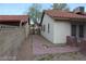 Charming backyard with a pathway between the home and garage at 1617 Joshua Tree Ct, Las Vegas, NV 89108