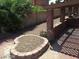 Backyard featuring a covered patio with brick columns and a brick garden feature, offering outdoor charm at 1617 Joshua Tree Ct, Las Vegas, NV 89108
