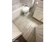 Bathroom featuring wood-look tile flooring, a toilet, and a tub/shower combo at 1617 Joshua Tree Ct, Las Vegas, NV 89108