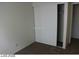 A simple bedroom features neutral carpet and walls, a closet, and a window for natural light at 1617 Joshua Tree Ct, Las Vegas, NV 89108
