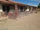 Exterior view of a home with brick columns and a brick garden box, offering outdoor charm at 1617 Joshua Tree Ct, Las Vegas, NV 89108