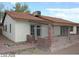Exterior view of a cozy home with a terracotta tile roof and brick accents at 1617 Joshua Tree Ct, Las Vegas, NV 89108