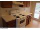 Well-lit kitchen includes a range, updated countertops, and convenient access to the backyard at 1617 Joshua Tree Ct, Las Vegas, NV 89108