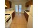 Functional kitchen featuring white appliances, ample cabinet space, and tile flooring for easy maintenance at 1617 Joshua Tree Ct, Las Vegas, NV 89108