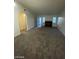 Spacious living room with a brick fireplace and large windows for lots of natural light at 1617 Joshua Tree Ct, Las Vegas, NV 89108