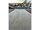 Wide angle shot of a long driveway along the street surrounded by other homes in the community at 1617 Joshua Tree Ct, Las Vegas, NV 89108