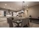 Modern dining room with view to the kitchen and backyard at 18 Garden Rain Dr, Las Vegas, NV 89135
