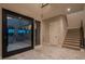 Open concept entryway with view to backyard and stairs to the second floor at 18 Garden Rain Dr, Las Vegas, NV 89135