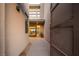 Modern home's gated entryway with desert landscaping and a view to the front door at 18 Garden Rain Dr, Las Vegas, NV 89135