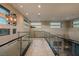 Hallway with glass railings, modern lighting, and contemporary design at 18 Garden Rain Dr, Las Vegas, NV 89135