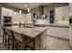Modern kitchen featuring a large island, stainless steel appliances, and stylish pendant lighting at 18 Garden Rain Dr, Las Vegas, NV 89135