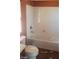 Bathroom including a tub/shower combo, toilet, and window at 1837 Ardilea St, Las Vegas, NV 89135