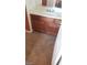 Bathroom featuring a white countertop and wooden cabinets, offering ample storage at 1837 Ardilea St, Las Vegas, NV 89135