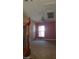 View from the stairs of a bedroom featuring carpet, a window with blinds, and a chandelier at 1837 Ardilea St, Las Vegas, NV 89135