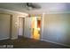 Bedroom with doorway view of ensuite bath, featuring neutral walls and flooring at 1837 Ardilea St, Las Vegas, NV 89135