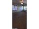Bright bedroom featuring a fan and dual windows for natural light and views at 1837 Ardilea St, Las Vegas, NV 89135