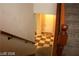 View from top of stairs of the entryway, featuring checkered floors and white door at 1837 Ardilea St, Las Vegas, NV 89135