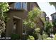 Exterior shot of stucco home with landscaped yard and fenced walkway at 1837 Ardilea St, Las Vegas, NV 89135