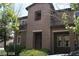 Charming two-story townhouse featuring stucco siding, balcony and landscaped front yard at 1837 Ardilea St, Las Vegas, NV 89135