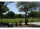 Expansive community green space with mature landscaping, lush lawns, and inviting walkways at 1837 Ardilea St, Las Vegas, NV 89135