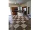 Eat-in kitchen featuring brown cabinets, stainless steel appliances and tile flooring at 1837 Ardilea St, Las Vegas, NV 89135