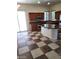 Eat-in kitchen featuring brown cabinets, stainless steel appliances and tile flooring at 1837 Ardilea St, Las Vegas, NV 89135