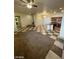 Bright living area features tile flooring and a kitchen island at 1837 Ardilea St, Las Vegas, NV 89135