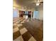 Bright living room features tile flooring, large windows, and a kitchen island at 1837 Ardilea St, Las Vegas, NV 89135