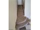 Carpeted staircase featuring rounded steps and white walls at 1837 Ardilea St, Las Vegas, NV 89135